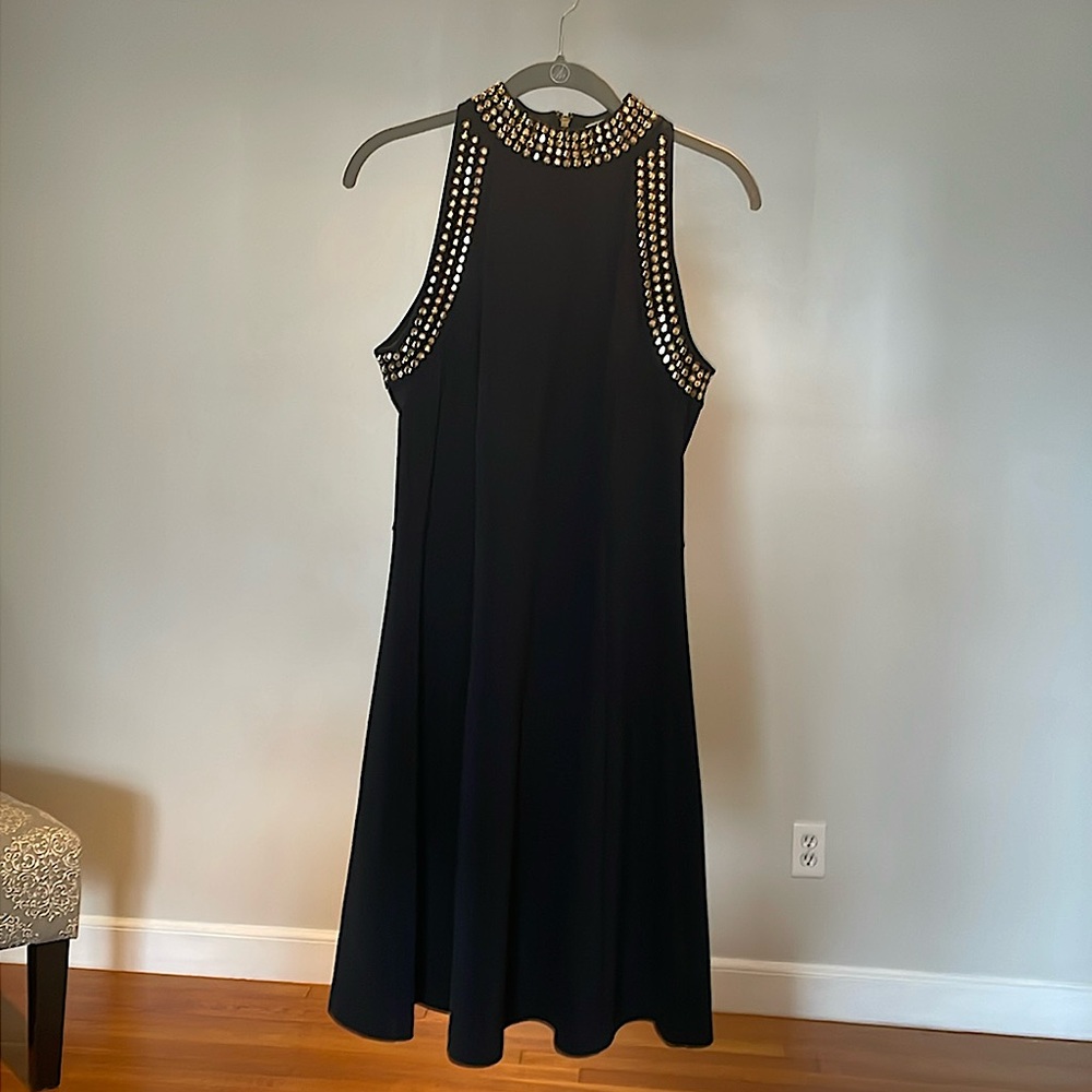 Black Michael Kors dress size 8 with gold embellishments.